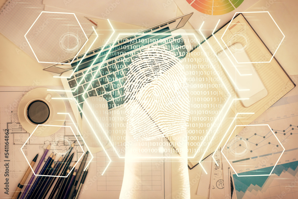 Poster finger print over computer on the desktop background. top view. double exposure. concept of securiti