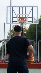 Young boy shooting basket