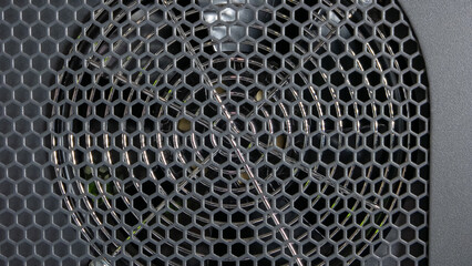 Metal mesh background. Cooler from a computer close-up.