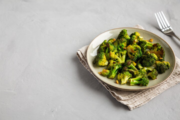 Homemade Pan-Fried Broccoli on a Plate, side view. Copy space.