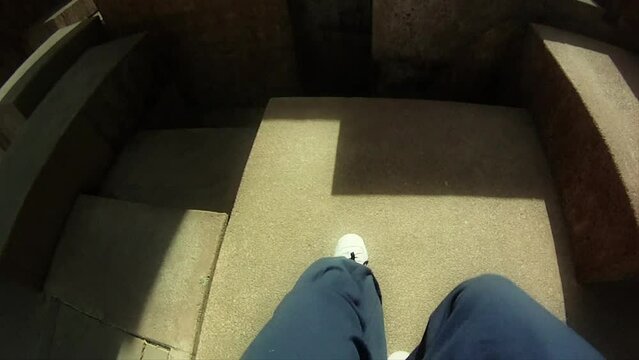 Point of view of a parkour runner traversing obstacles, running and jumping off the buildings