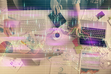 Multi exposure of man and woman working together and financial chart hologram. Business concept. Computer background.