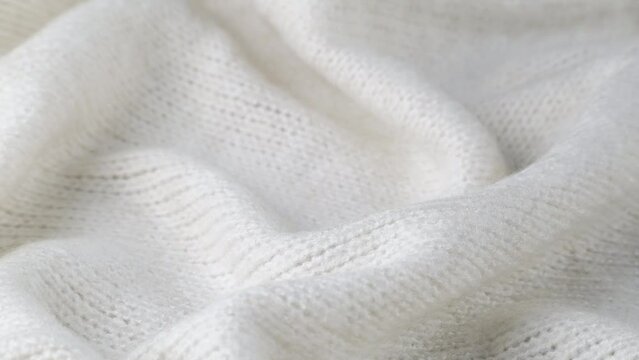 Fashionable knitted woolen cloth, warm soft textile close up view
