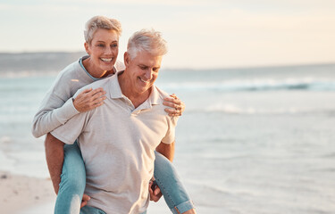 Love, beach and piggyback with a senior couple walking by the sea or ocean while on a date in summer together. Nature, earth and water with an elderly man and woman pensioner taking a walk on a coast - Powered by Adobe