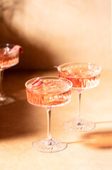 Rhubarb gin and tonic cocktail, front view of glasses with alcohol cocktail