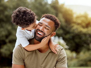 Father, bonding kiss and boy child hug happy in nature with quality time together outdoor. Happiness, laughing and family love of a dad and kid in a park enjoying nature hugging with care and a smile - Powered by Adobe