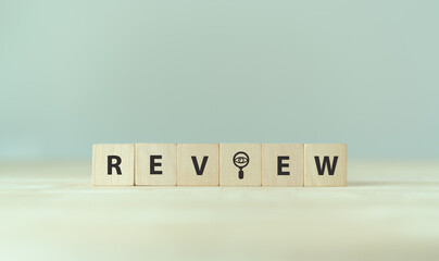 Review text on wooden cube blocks. Review evaluation time for review inspection assessment...