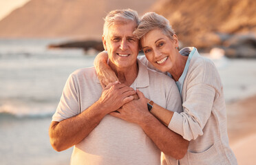 Couple, senior and beach with smile, hug and love on holiday, vacation or relax with romance. Elderly, woman and man by sea, ocean or waves for portrait, together or care in retirement with happiness - Powered by Adobe