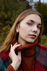 portrait of a happy woman in an autumn park