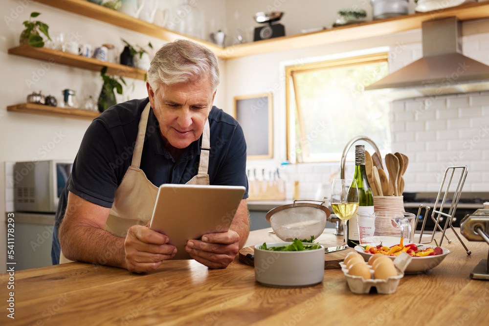 Canvas Prints Senior, man and tablet in kitchen, cooking or internet for reading, video or email in house. Elderly, home and food for recipe, digital or ingredients on internet, web or app in home for retirement