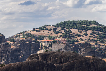 Fototapeta na wymiar Medieval Varlaam monastery is perched on a steep and magnificent pillar-like rock which rises above the town of Kalambaka, second big in size in Meteora, Central Greece