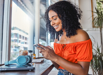 Coffee shop, black woman and phone while happy, excited and typing on phone for communication app...