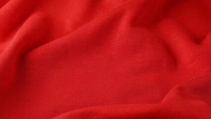 Wavy red cloth, ondulate textile close up view
