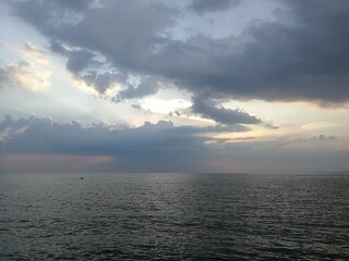 The​ sea​ and​ the​ sky​ in​ the​ evening.​ Blue​ sky​ and​ blue​ sea.​