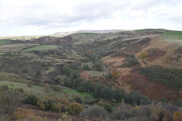 Fototapeta premium Countryside views from the top of a mountain with rural farmland and far reaching views. Taken in Bury Lancashire England. 