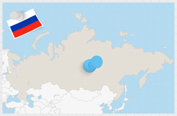 Map of Russia with a pinned blue pin. Pinned flag of Russia.