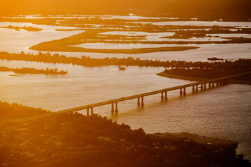 Summer view to Kama and Sviyaga river from above. Sunset landscape in Russia. Boats and ferries on...