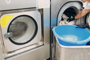 Dry cleaning with washing machine dryer spin clothes. Clean cloth chemical process. Laundry...