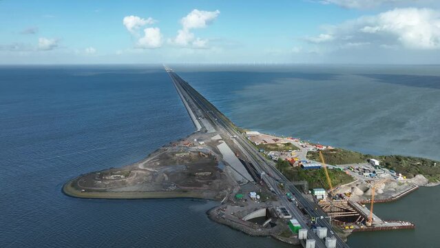 Afsluitdijk construction on pumping stations new sluices and the A7 near Den Oever, Kornwerderzand , and Zurich. Lock for shipping, road traffic cyclists and walkers. Aerial drone view.