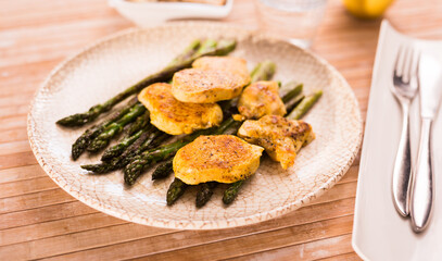 dietary meal rich in protein. Stir fried chicken breast and green asparagus