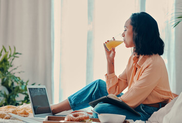 Relax, laptop and woman streaming a movie for brunch in a hotel or house bedroom enjoying a holiday...