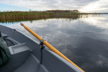 view with lake, reeds in marsh lake, boat oar, fishing concept, autumn