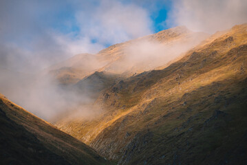 Fototapeta premium Foggy Sunset In The Mountains
