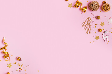 Christmas golden decorations on pink background. Christmas creative minimal background for greeting card