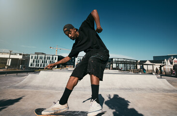 Black man, skater on skateboard and skate trick in a park in Los Angeles California summer sun for...