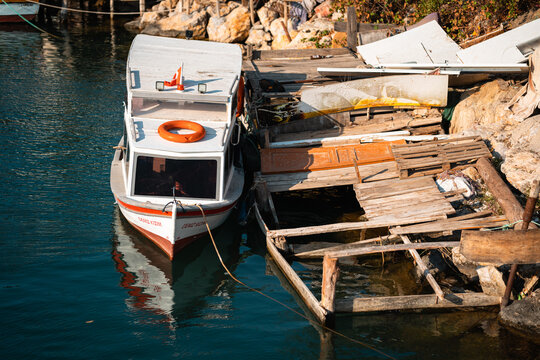 Fishing Boat on Cobbled-Together Pier, Akcay Turkey