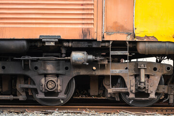 Close-up at an ancient model train head cabin and chassis part. Transportation vehicle equipment photo. Selective focus.