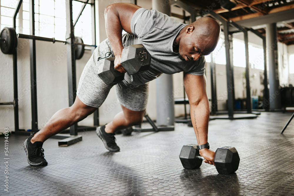 Sticker dumbbell, fitness and bodybuilder black man with workout training in gym or garage studio for wellne