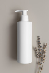 White cosmetic shampoo dispenser bottle mockup with a lavender on the beige background.