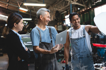 professional male technician mechanic man working to repair maintenance automobile at auto car garage service, talking with vehicle owner client about workshop job, automotive engine business shop