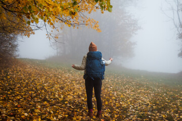 Confused tourist does not know which way to go. Lost hiker in fog. Worried woman with backpack...