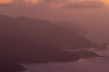 Foggy layer of mountains at sunrise time.