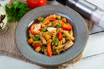Pasta with fried chicken, mushrooms, pepper and pumpkin