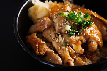 Grilled Chicken teriyaki rice Japanese food isolated in black background