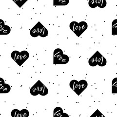 Black heart Love vector seamless dotted texture. Black and white pattern for valentine card design. Love clipart background.