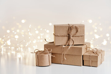 Christmas sustainable gift boxes composition on shining bokeh background. Christmas zero waste,...