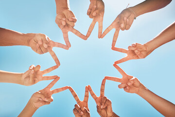 Group, hands and fingers with star for peace, solidarity and blue sky in sunshine on vacation....