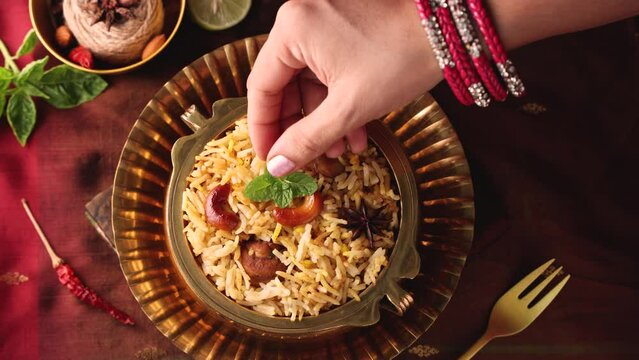 Chicken biryani Spicy Indian Malabar biryani Hyderabadi biryani, Dum Biriyani pulao golden bowl Kerala India Sri Lanka Pakistan basmati rice mixed rice dish with meat curry Ramadan Kareem, Eid