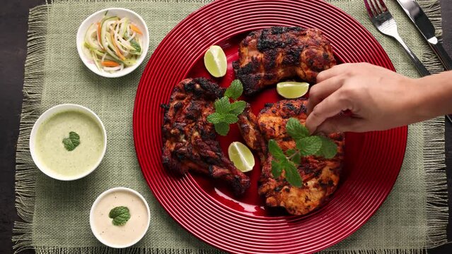 Alfaham Chicken , Arabian spicy food tandoori whole chicken Bengaluru, India . Platter served with salads. Al Faham Charcoal Grilled Chicken in India . 4k video footage.