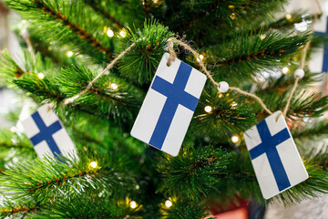 Christmas in Finland. Finnish flags on a Christmas tree.
