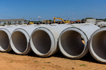Large cement sewage concrete pipes to construct drainage systems for industrial buildings on the...