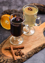 Christmas hot mulled wine with cinnamon on retro background
