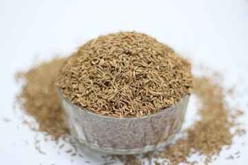 Cumin seeds decorated on white background