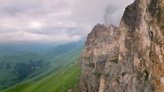 Aerial view of mystical rocks high in the mountains. Clouds on the rocks. natural video background