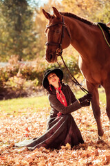 Girl in a hat on a horse