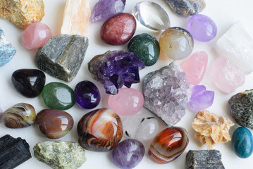 Semi-precious stones of different colors. Amethyst and amethyst druse crystals, rose quartz, agate,...